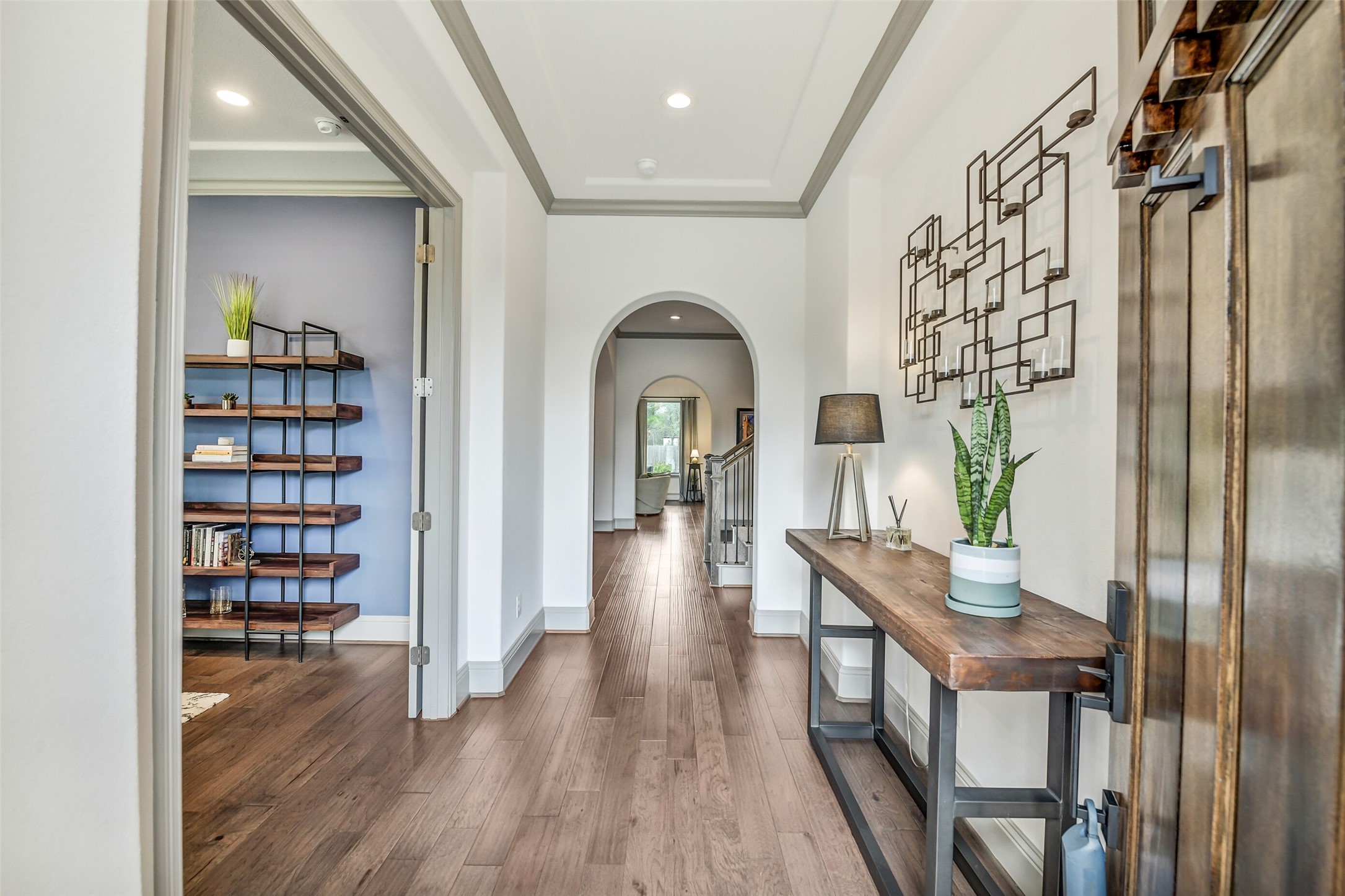 2430 Barclay Lake Lane Spring, TX 77388 - Photo 44 of 50 a view of a hallway to a livingroom with furniture wooden floor and windows