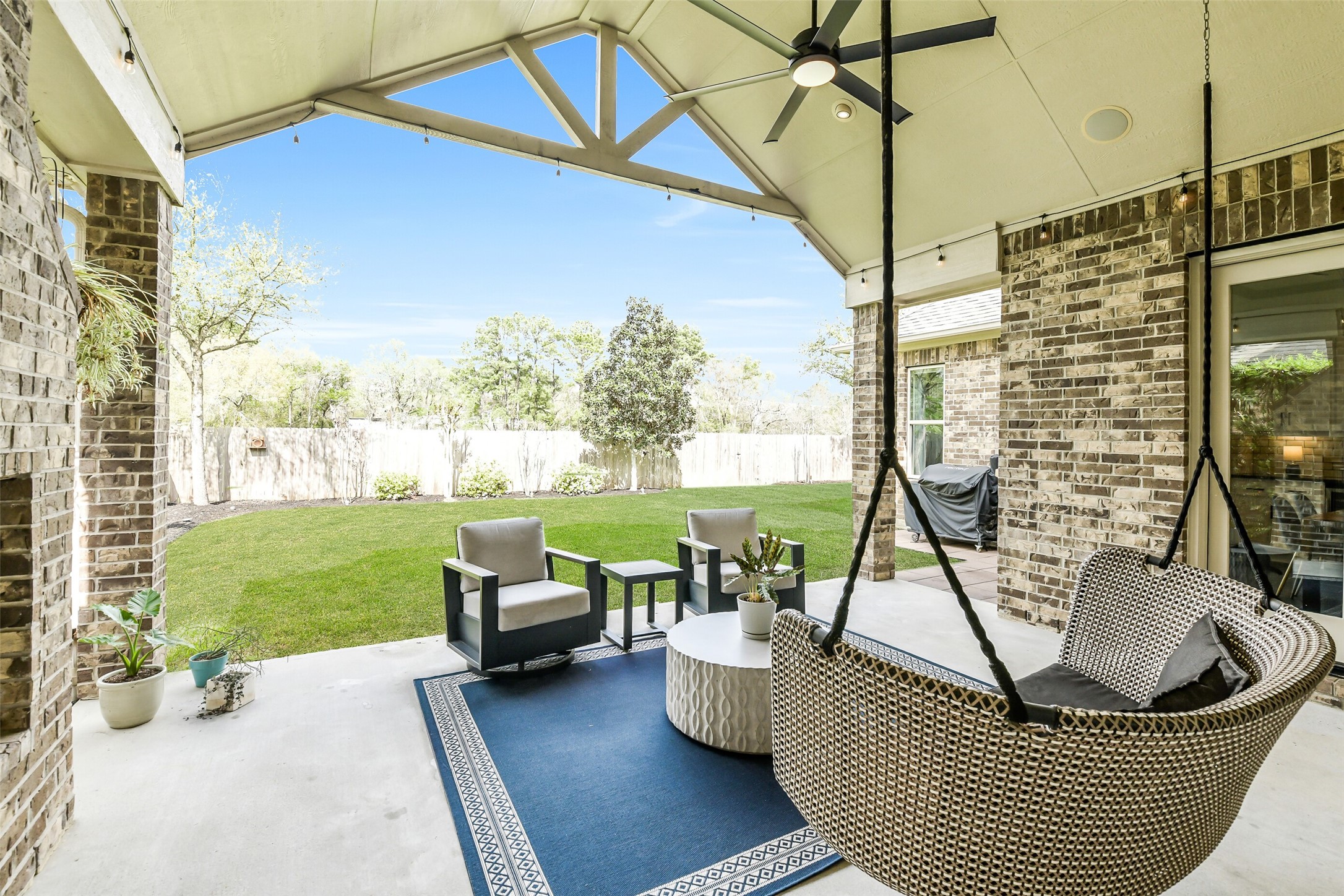 2430 Barclay Lake Lane Spring, TX 77388 - Photo 47 of 50 a view of a patio with couches chairs and a table