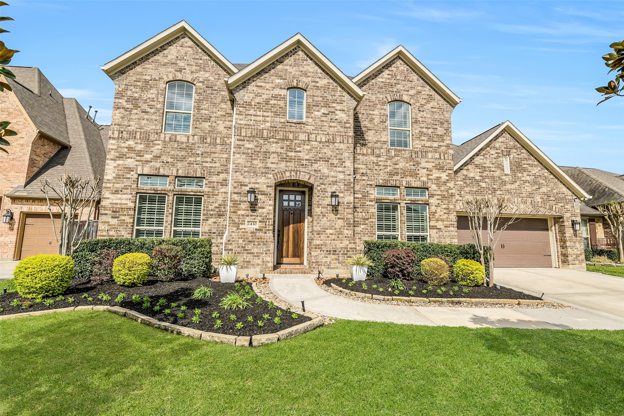 2430 Barclay Lake Lane Spring, TX 77388 - Photo 7 of 50 a front view of a house with a garden and porch
