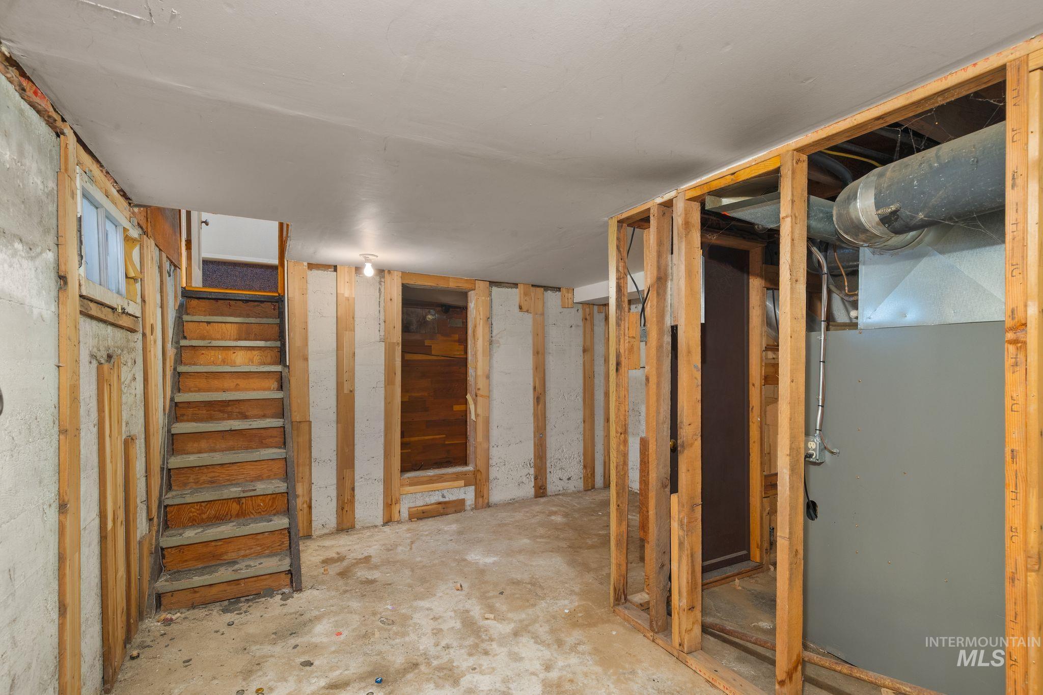 2255 Appleside Boulevard Clarkston, WA 99403 - Photo 25 of 41 Stairwell featuring wood-panel walls and concrete steps