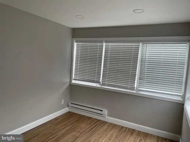 a view of a room that has a window