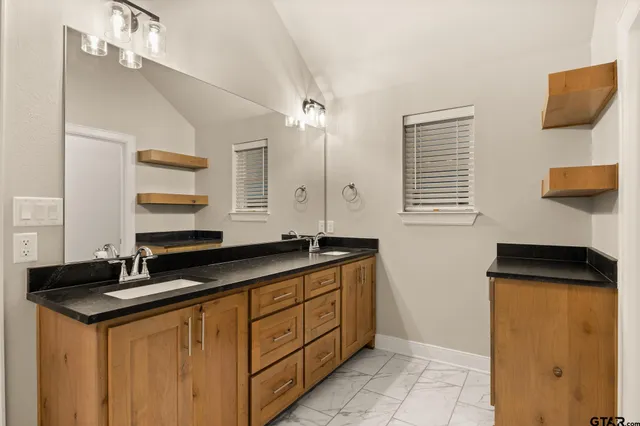 a kitchen with a sink and a refrigerator