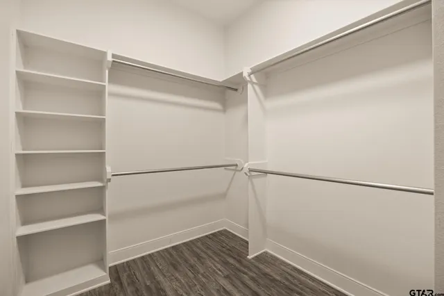 a view of an empty walk in closet