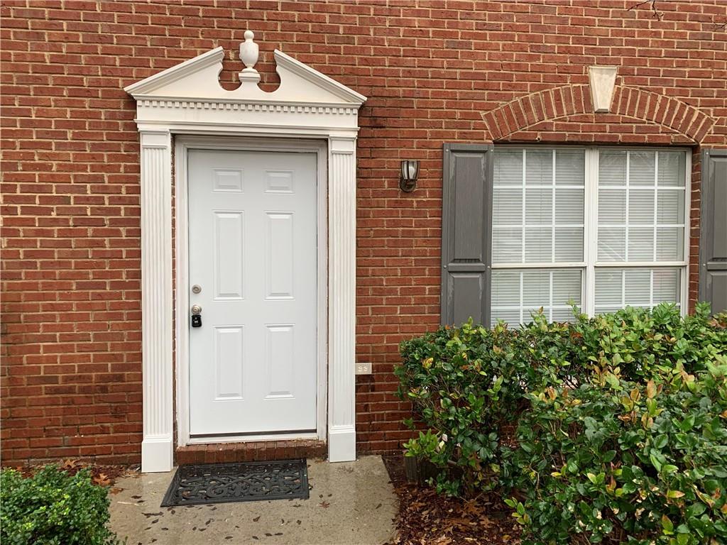 a front view of a house with a glass windows