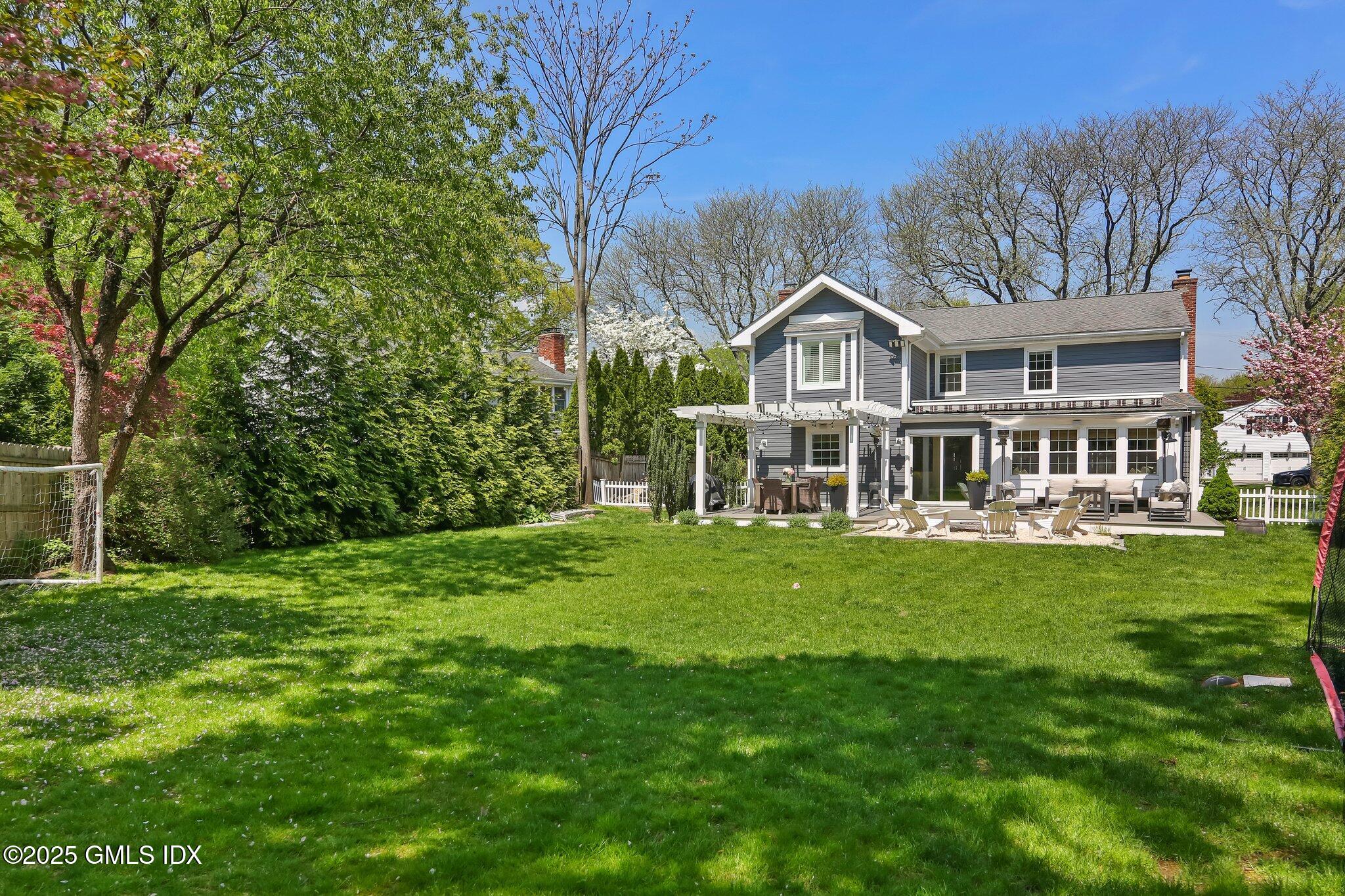 41 Rainbow Drive Riverside, CT 06878 - Photo 6 of 7 a front view of a house with a garden