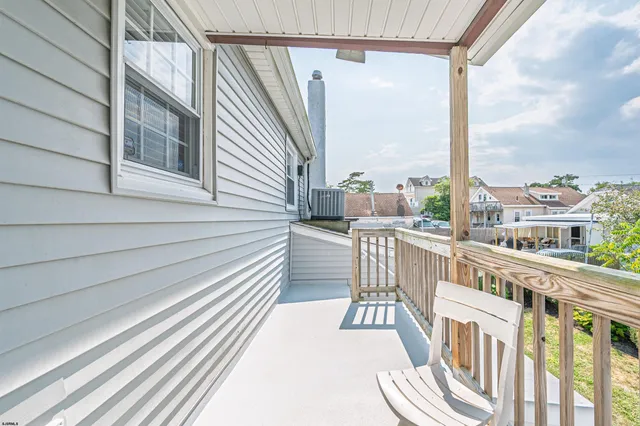 a view of a balcony with furniture