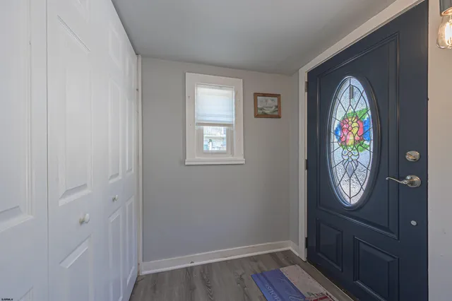 wooden floor with a mirror and a window in it