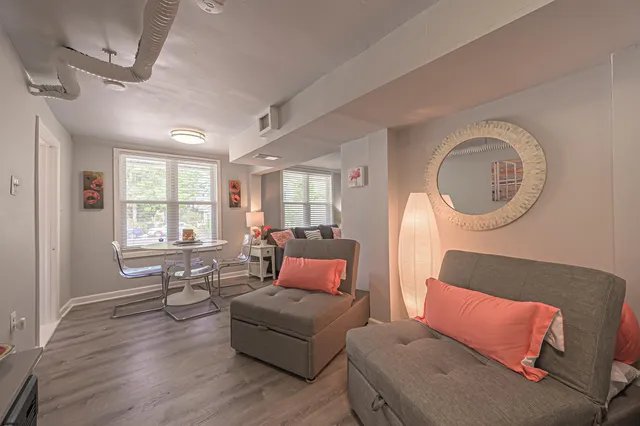 a living room with furniture and a large window