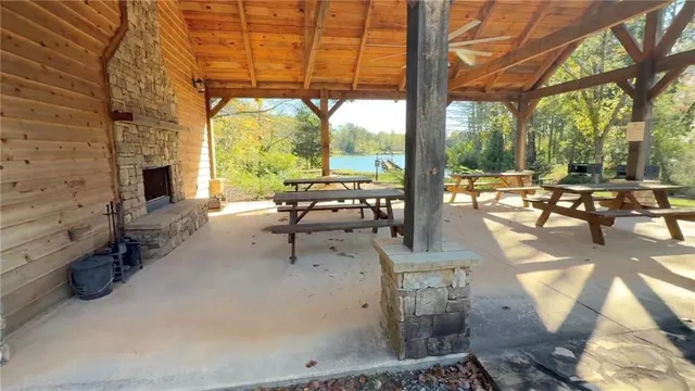 a building outdoor space with patio furniture and potted plants