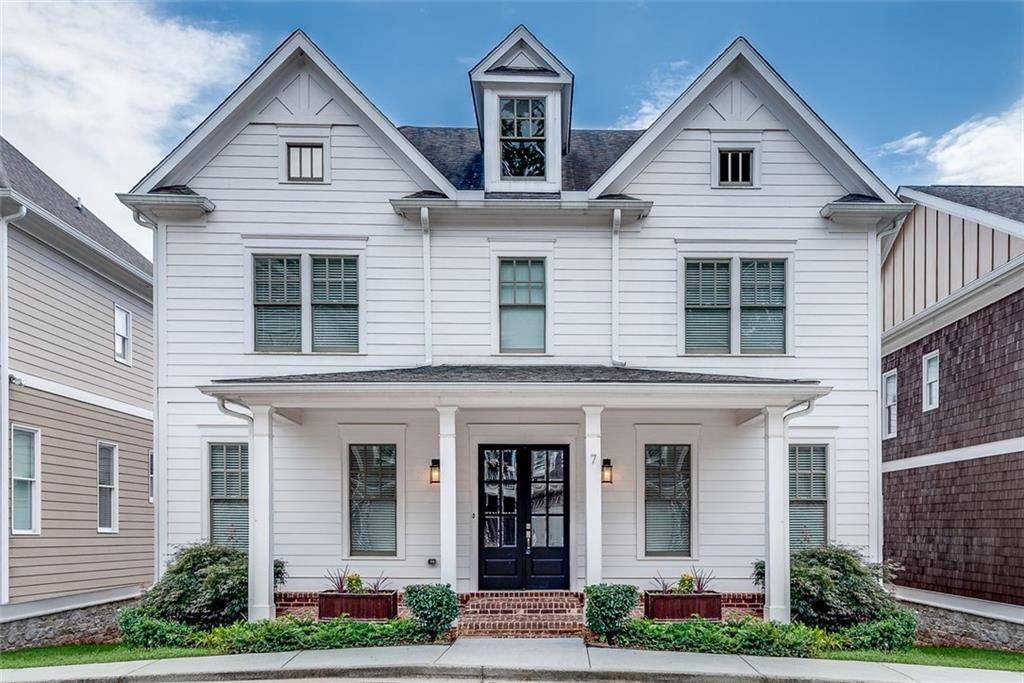 7 McEvoy Lane Decatur, GA 30030 - Photo 1 of 1 a view of a white house with potted plants and a yard