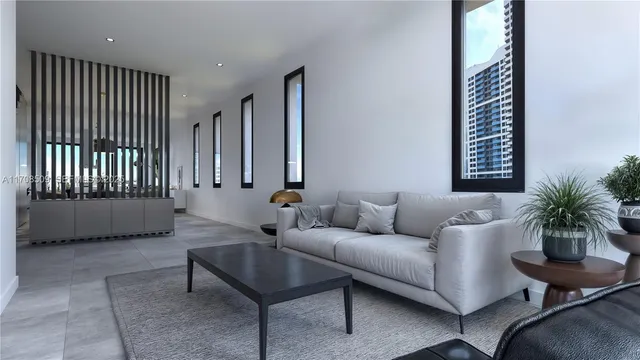 a living room with furniture and a potted plant