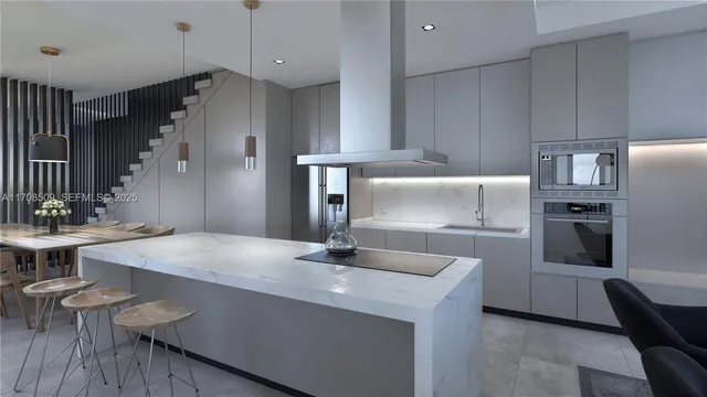 a kitchen with kitchen island a sink stove and refrigerator