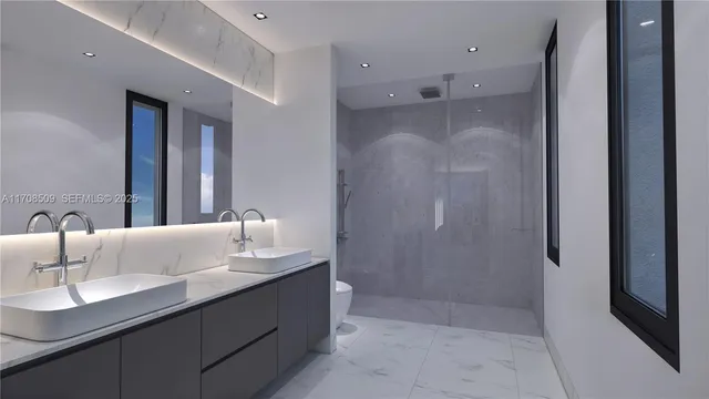 a bathroom with a sink a mirror and shower