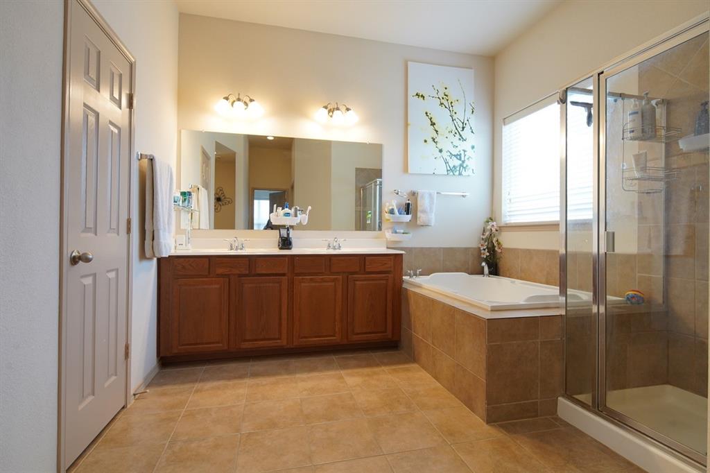 4508 Fox Rio Trail Arlington, TX 76017 - Photo 15 of 28 a bathroom with a double vanity sink toilet and shower