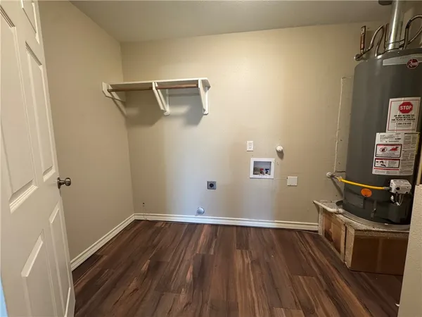 a view of a storage & utility room with wooden floor