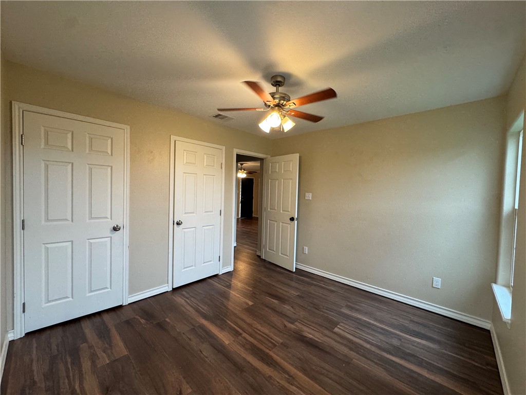 4722 Queen Drive Corpus Christi, TX 78415 - Photo 10 of 13 a view of an empty room with wooden floor