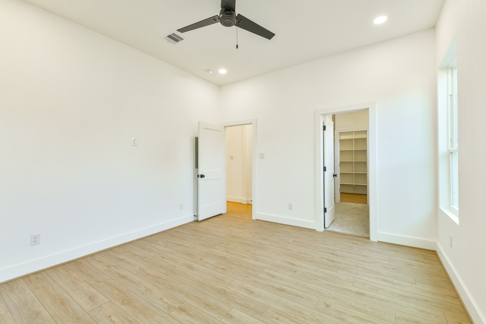 162 Wallace Street, Unit B Houston, TX 77022 - Photo 13 of 25 wooden floor in an empty room