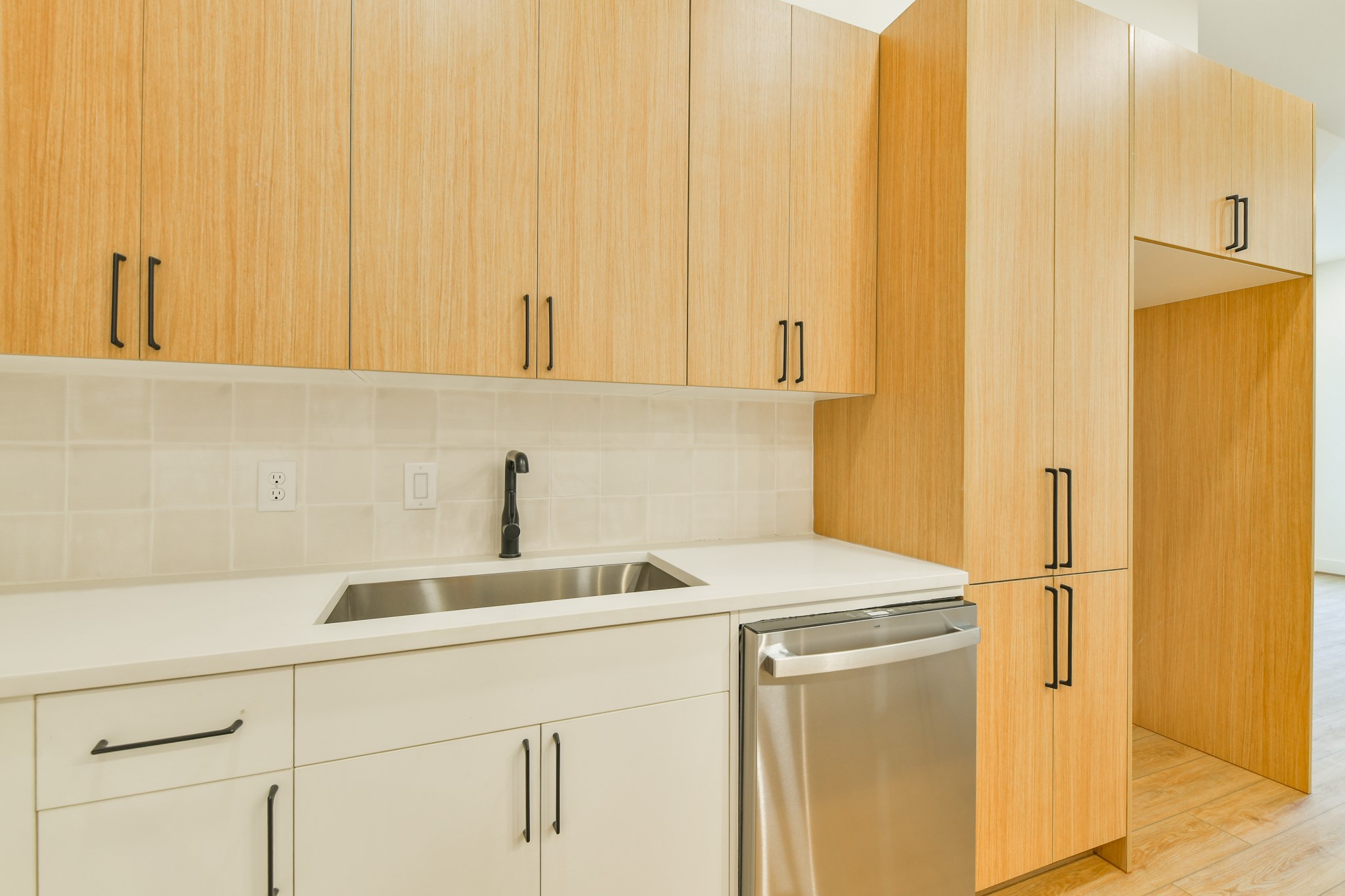 162 Wallace Street, Unit B Houston, TX 77022 - Photo 9 of 25 a kitchen with a sink and a refrigerator