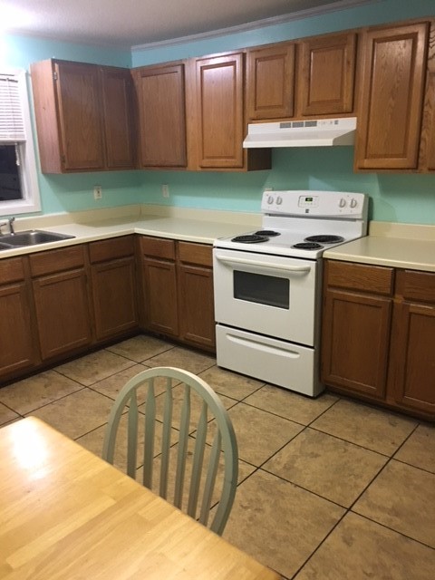 4042 Loop 1781 Rockport, TX 78382 - Photo 11 of 33 a kitchen with a cabinets and wooden floor