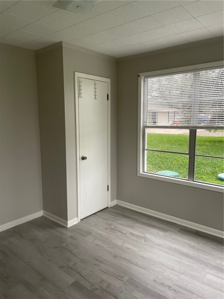 4042 Loop 1781 Rockport, TX 78382 - Photo 5 of 33 a view of empty room with wooden floor and fan