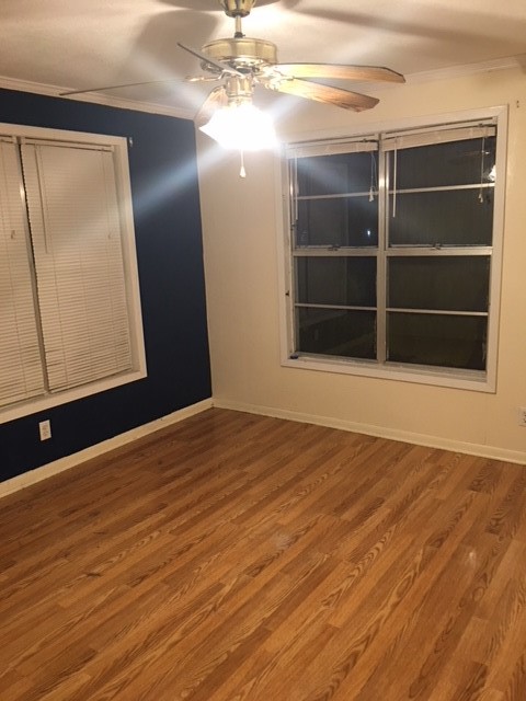 4042 Loop 1781 Rockport, TX 78382 - Photo 10 of 33 a view of an empty room with wooden floor and a window