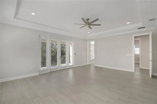 a spacious bathroom with a double vanity sink mirror and shower