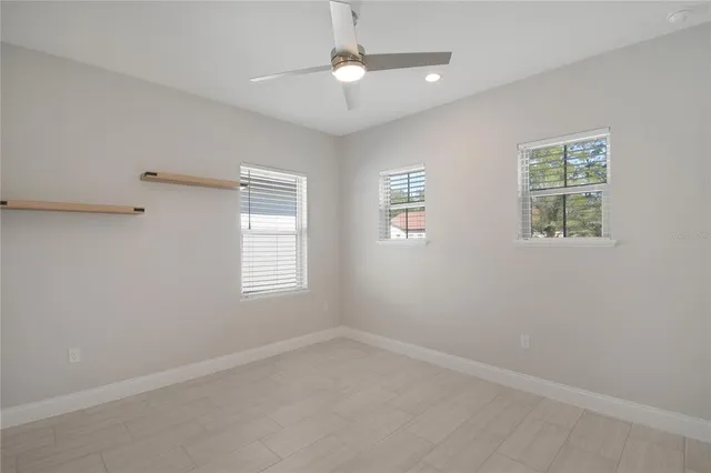 a view of an empty room with a window