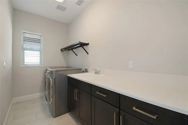 a view of a backyard with plants and a backyard