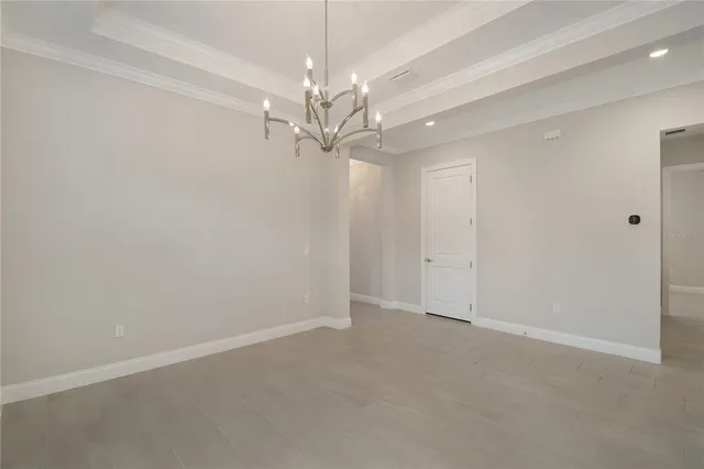 a large kitchen with kitchen island a sink stainless steel appliances and cabinets