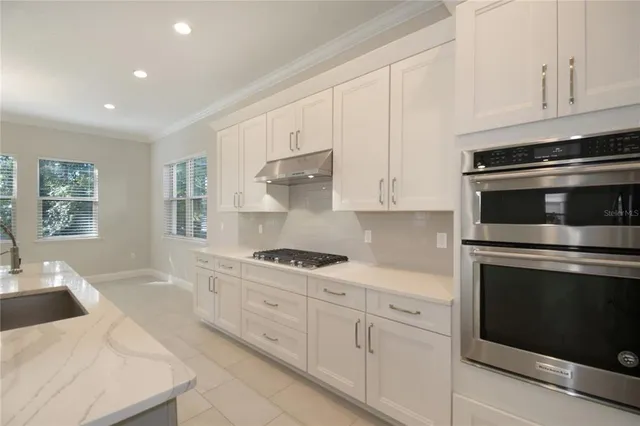 a kitchen with sink and window
