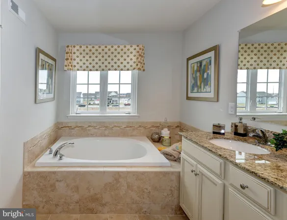a bath tub sitting next to a window
