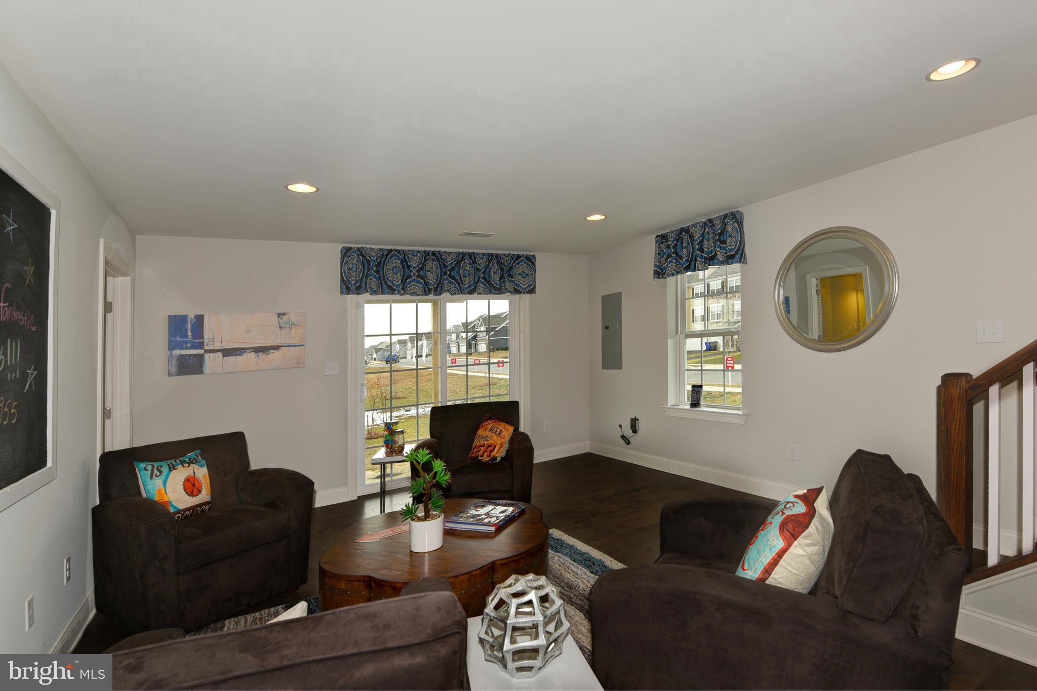 1300 Carrick Court, Unit MASSEY Middletown, DE 19709 - Photo 16 of 19 a living room with furniture and a fireplace