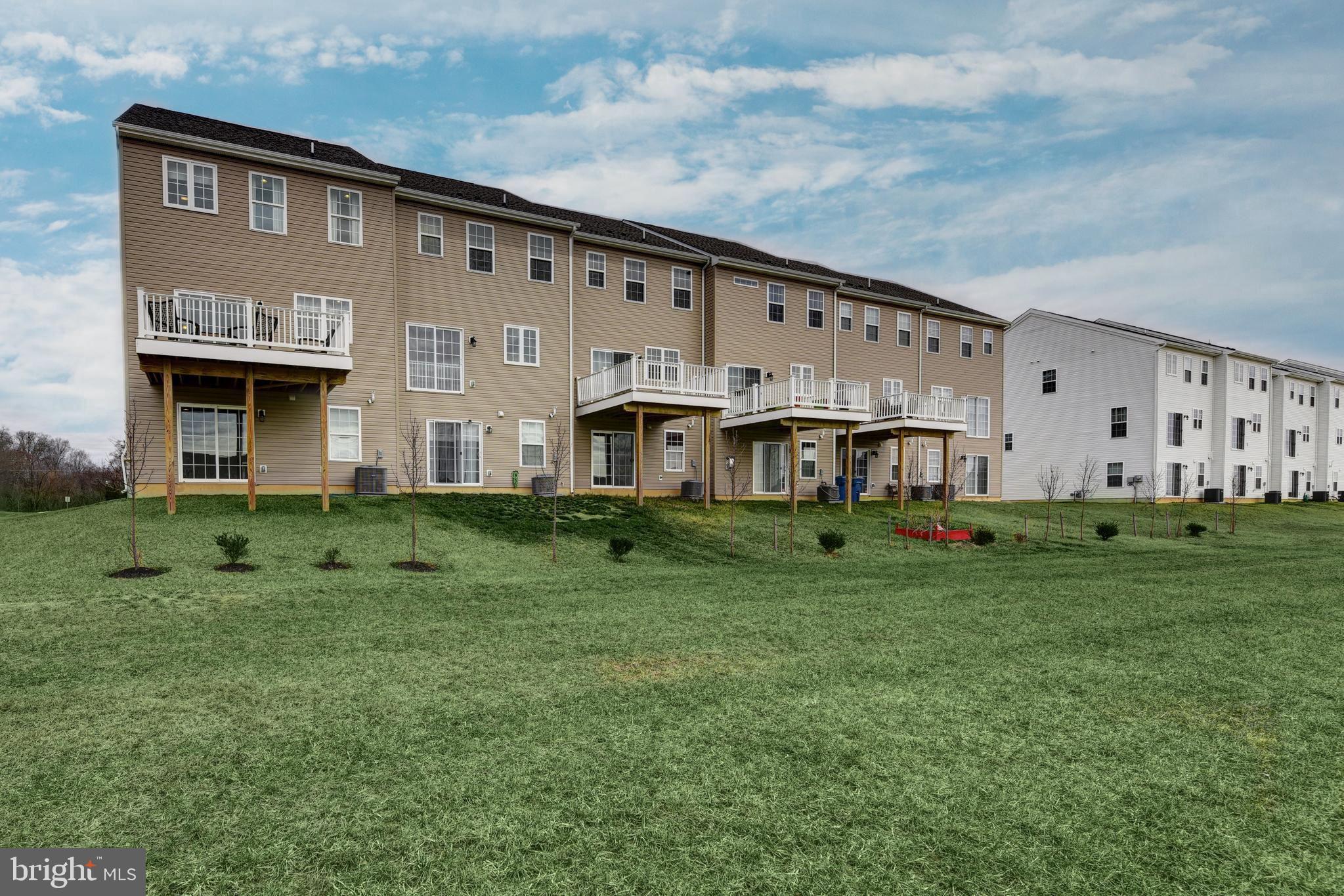 1300 Carrick Court, Unit MASSEY Middletown, DE 19709 - Photo 19 of 19 a front view of a house with a yard