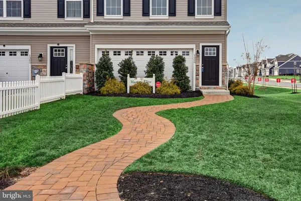 a view of a house with a yard and plants