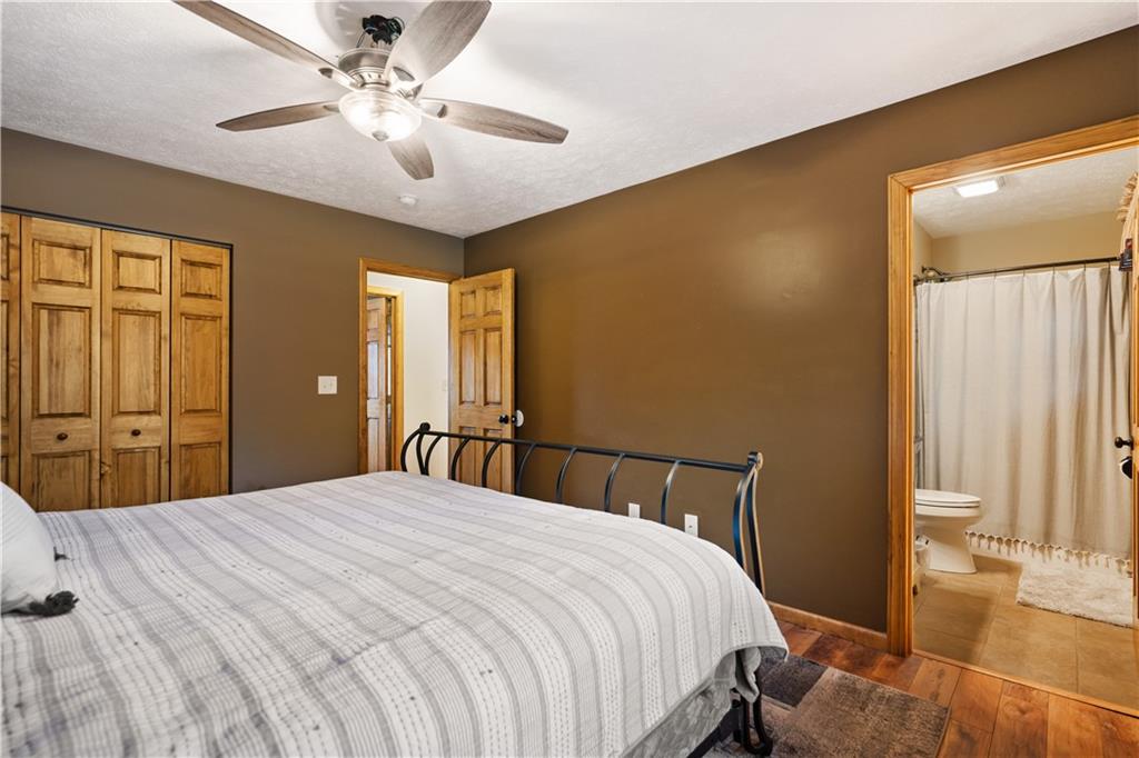 418 Shagbark Road Grindstone, PA 15442 - Photo 11 of 20 a bedroom with a bed and a chandelier