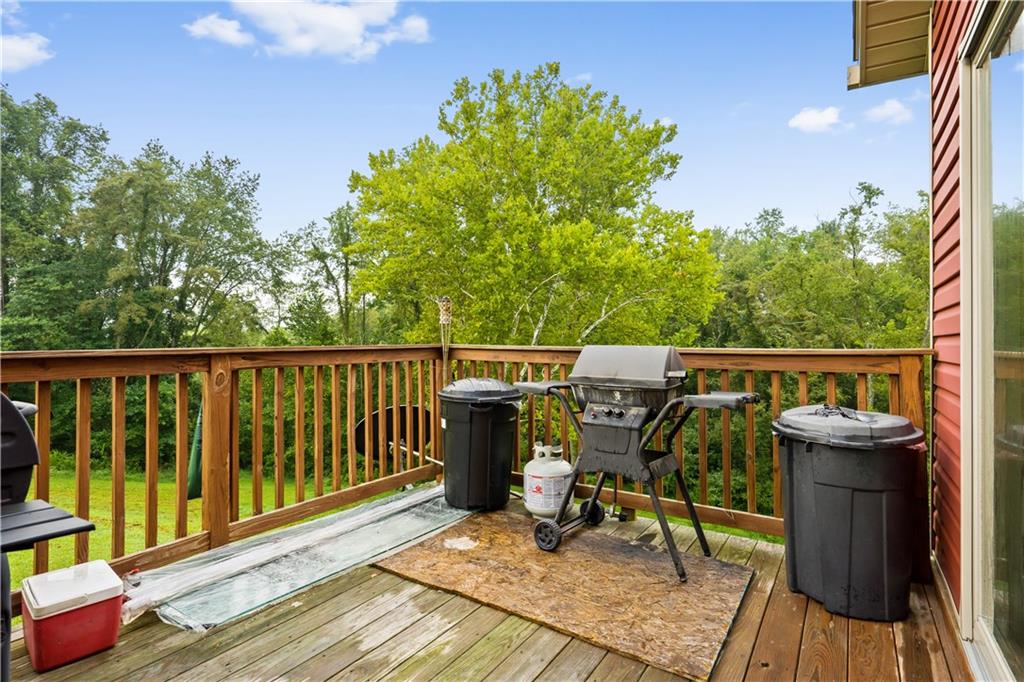 418 Shagbark Road Grindstone, PA 15442 - Photo 14 of 20 a view of a deck with wooden floor and seating space