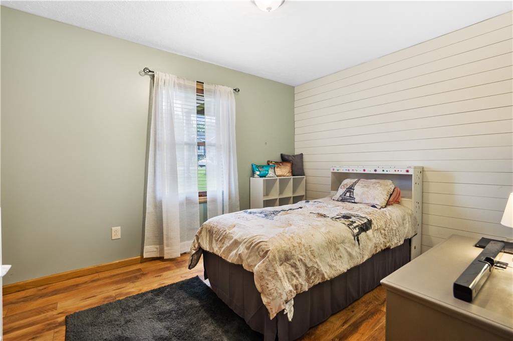 418 Shagbark Road Grindstone, PA 15442 - Photo 9 of 20 a bedroom with a bed and a table