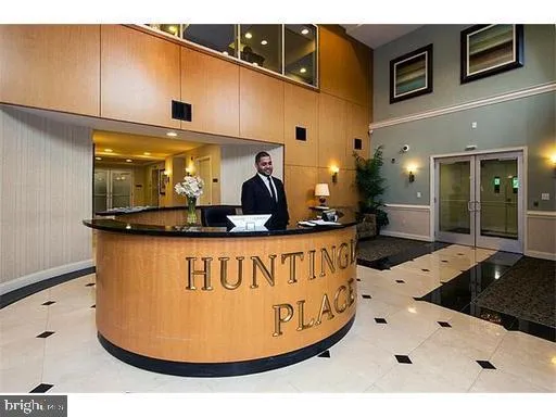 a view of kitchen with stainless steel appliances granite countertop a sink and a microwave