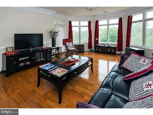 438 Carson Terrace Huntingdon Valley, PA 19006 - Photo 6 of 23 a living room with furniture and a flat screen tv