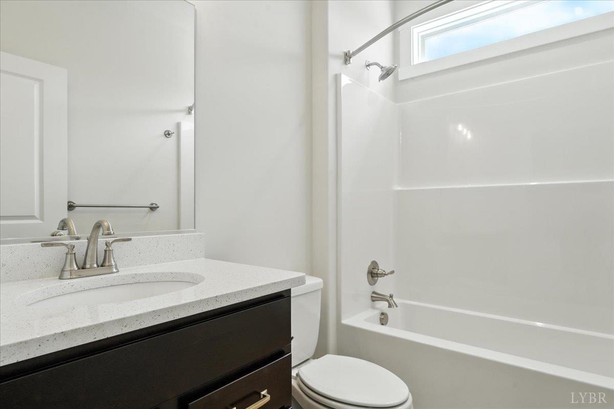 2140 Bent Creek Road Concord, VA 24538 - Photo 32 of 35 a bathroom with a sink a toilet and shower