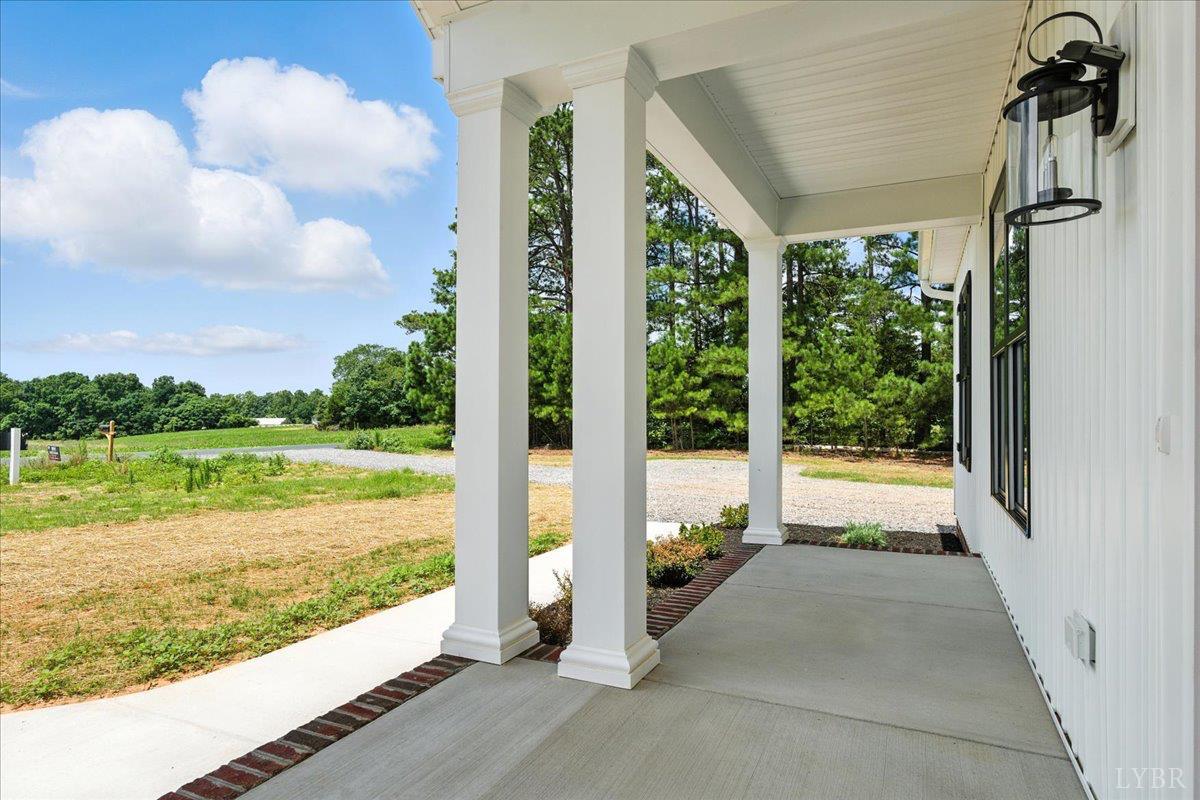 2140 Bent Creek Road Concord, VA 24538 - Photo 5 of 35 a view of a balcony with lake view and a floor to ceiling window