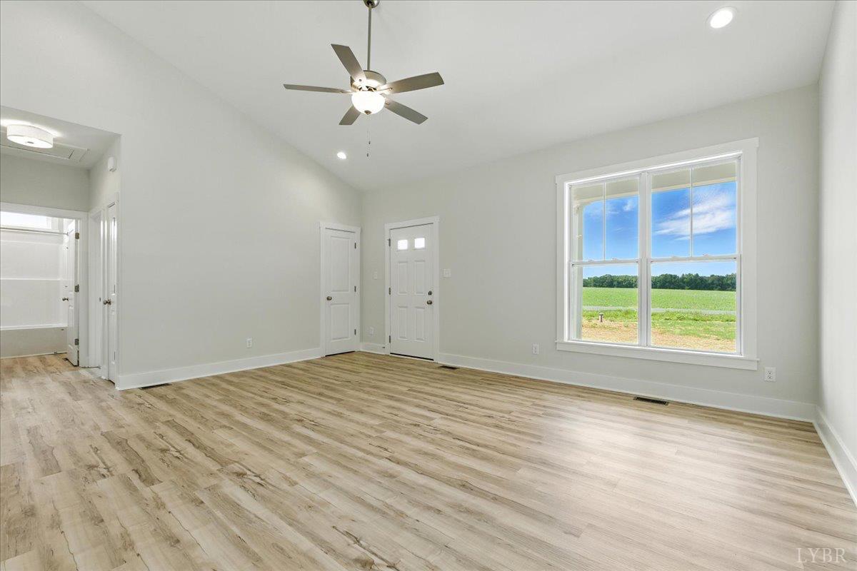 2140 Bent Creek Road Concord, VA 24538 - Photo 9 of 35 an empty room with wooden floor and windows