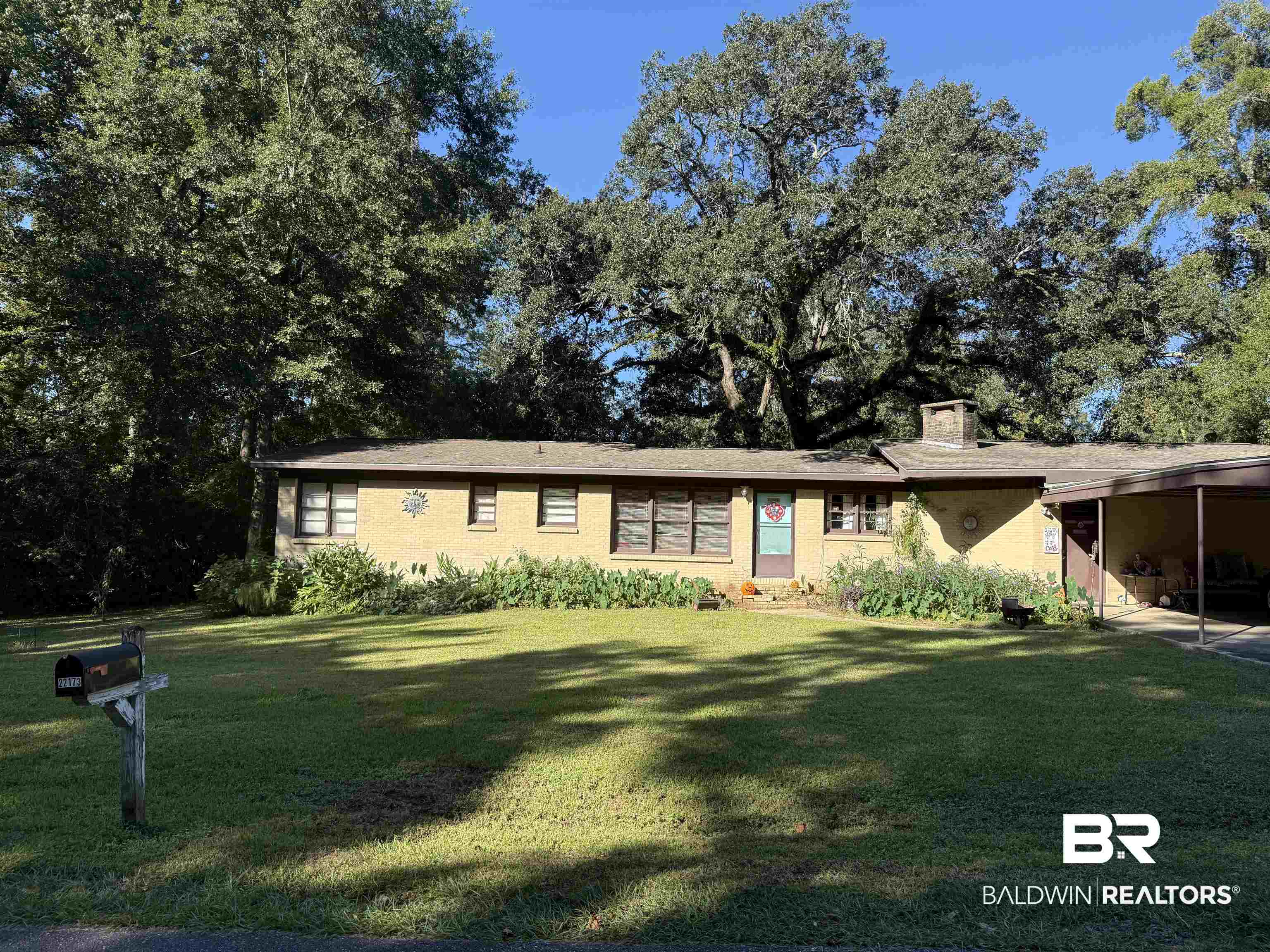 22173 1st Street Silverhill, AL 36576 - Photo 2 of 16 Ranch-style house featuring a front yard and a chimney