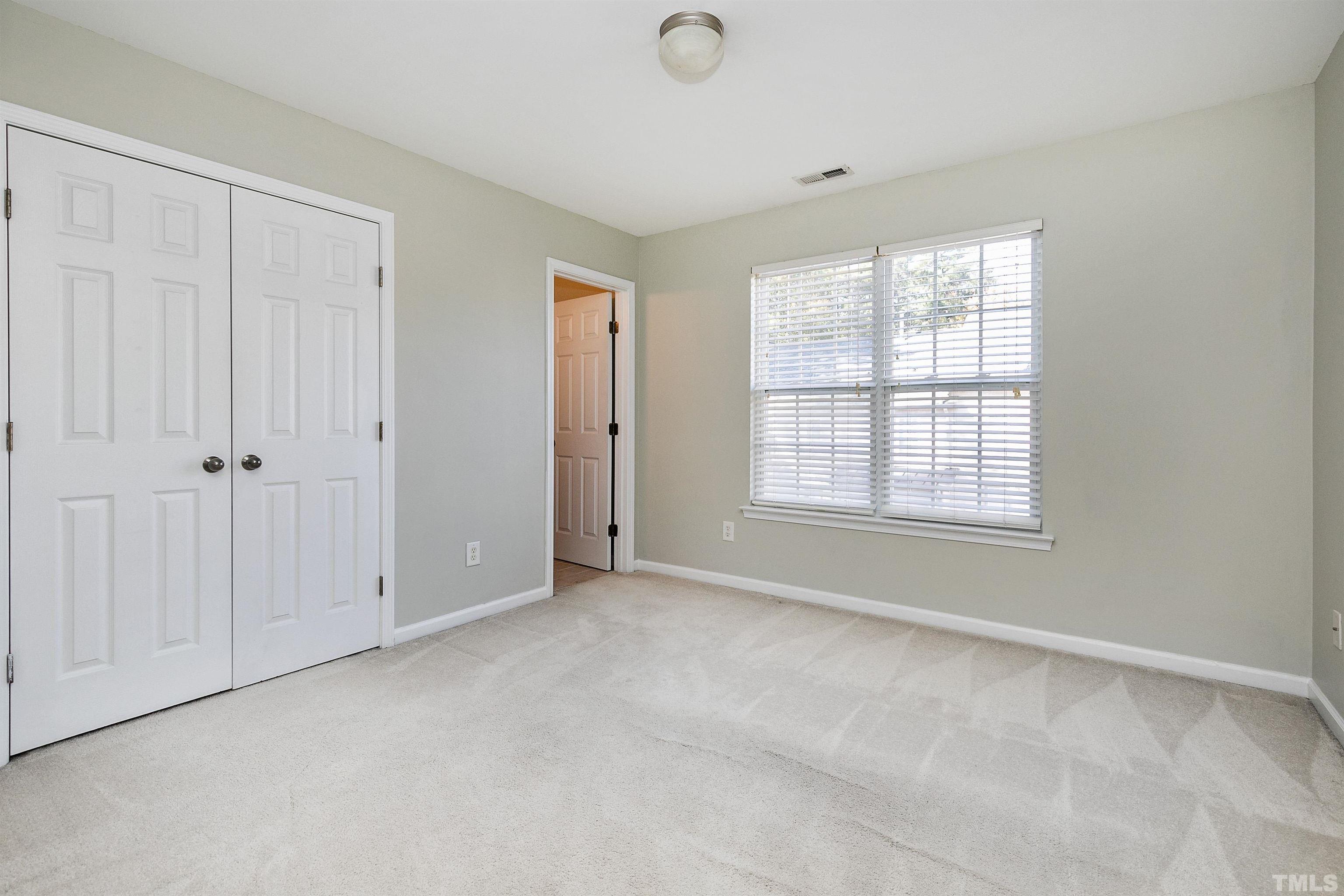 9909 Layla Avenue Raleigh, NC 27617 - Photo 22 of 30 a view of an empty room with a window