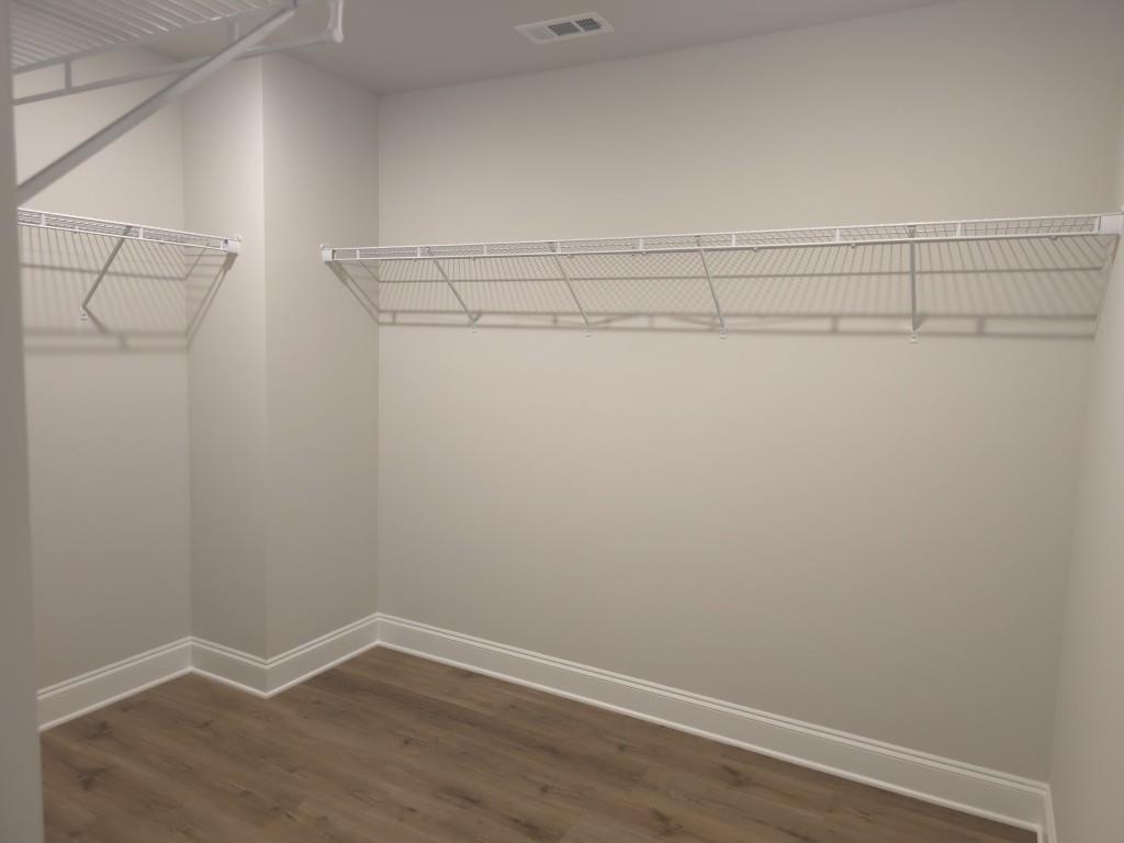 4240 Cavalier Way Duluth, GA 30097 - Photo 28 of 46 a view of a room with racks on the wall