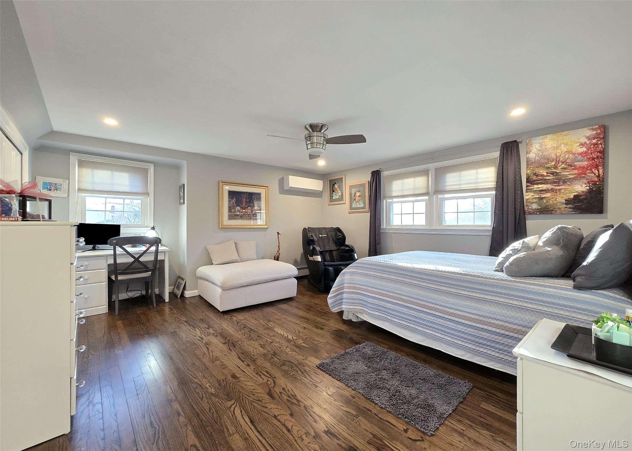 94 Clarendon Road Ronkonkoma, NY 11779 - Photo 11 of 31 a bedroom with furniture and a large window