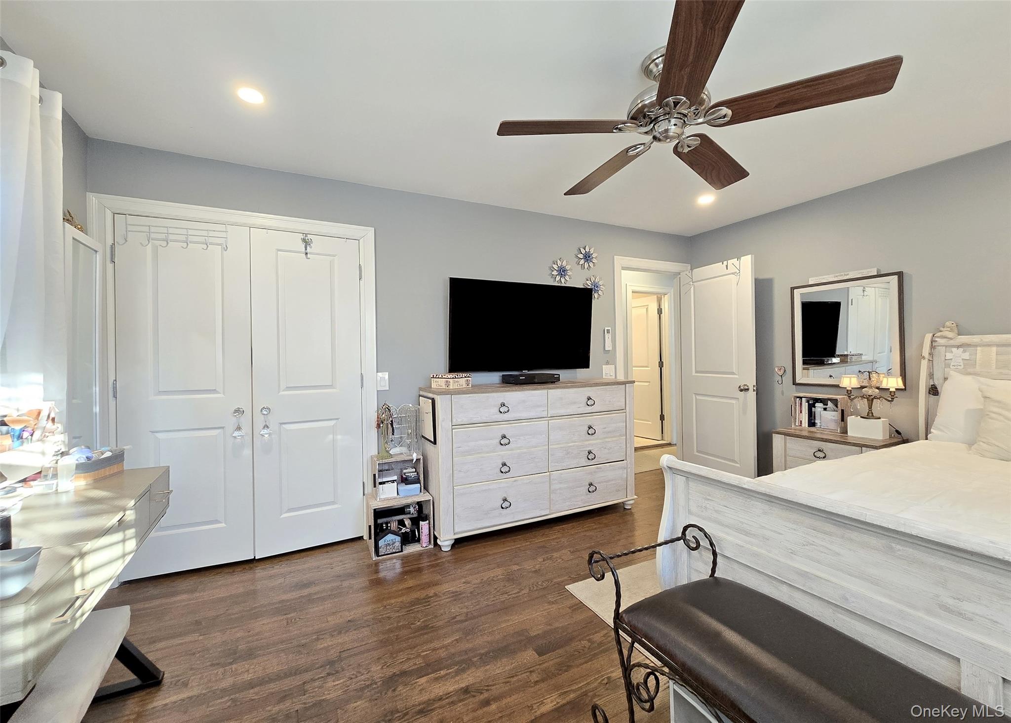 94 Clarendon Road Ronkonkoma, NY 11779 - Photo 17 of 31 a view of a livingroom with furniture and a flat screen tv