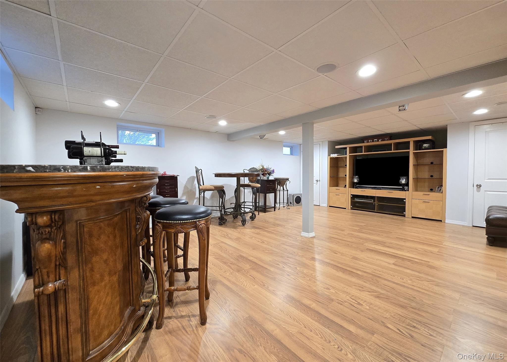 94 Clarendon Road Ronkonkoma, NY 11779 - Photo 20 of 31 a view of a kitchen with furniture and wooden floor