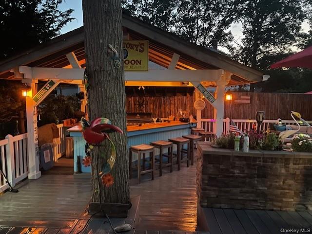 94 Clarendon Road Ronkonkoma, NY 11779 - Photo 25 of 31 a view of a chairs and tables in the patio