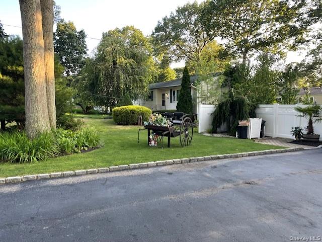 94 Clarendon Road Ronkonkoma, NY 11779 - Photo 31 of 31 a view of a house with a yard and sitting area